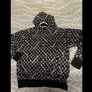 Women’s size small/medium Louis Vuitton/supreme sweater in like new condition